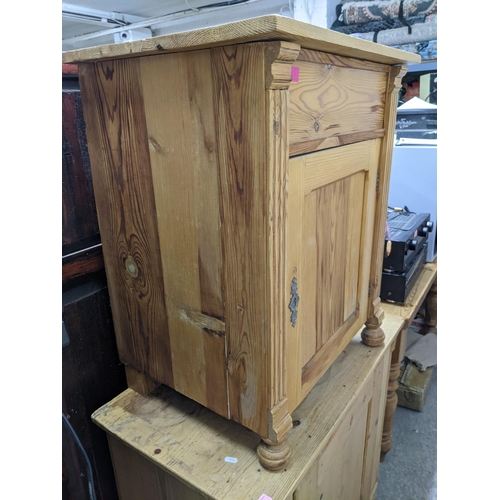 353 - A Victorian pine side cupboard with single panelled door on bun front feet 80cm x 85cm x 49cm, and a... 