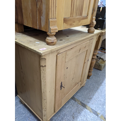 353 - A Victorian pine side cupboard with single panelled door on bun front feet 80cm x 85cm x 49cm, and a... 