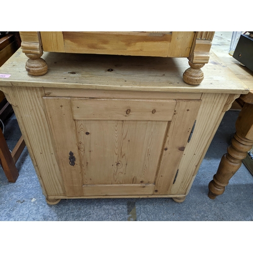 353 - A Victorian pine side cupboard with single panelled door on bun front feet 80cm x 85cm x 49cm, and a... 