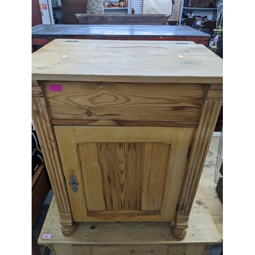 353 - A Victorian pine side cupboard with single panelled door on bun front feet 80cm x 85cm x 49cm, and a... 