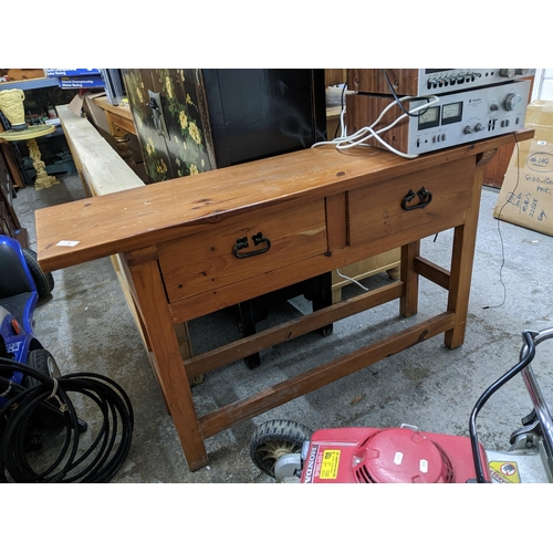 354 - A 20th century Chinese altar table with two short drawers on square legs united by square stretchers... 