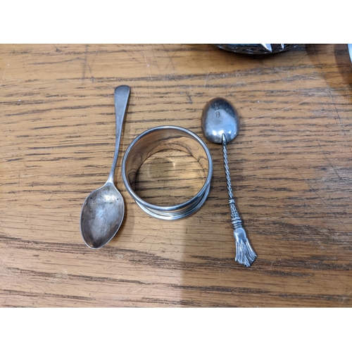 363 - Silver comprising two spoons and a napkin ring 30g, and silver plate to include flatware, a tray, a ... 