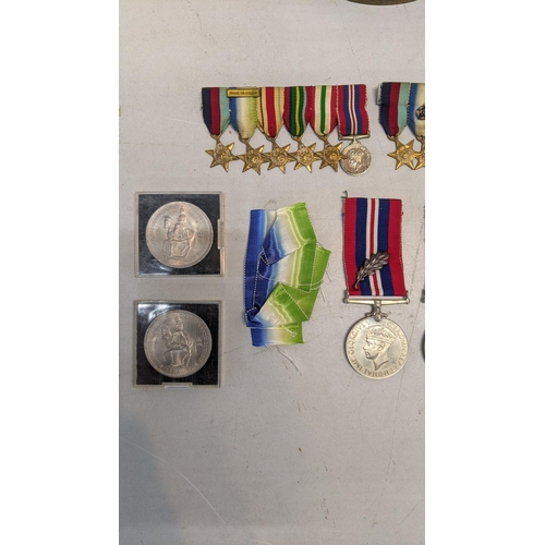 378 - A collection of WWI and WWII miniature medal bars to include a Royal Naval Reserve decoration and WW... 