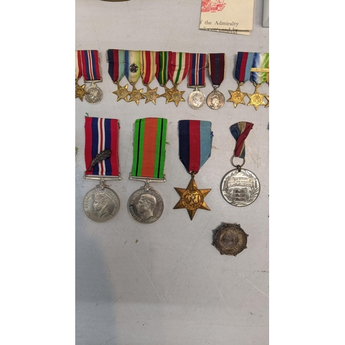 378 - A collection of WWI and WWII miniature medal bars to include a Royal Naval Reserve decoration and WW... 