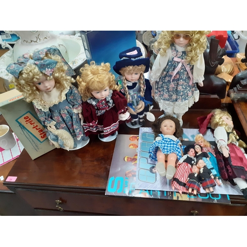 381 - Late 20th century collectors dolls, mainly on stands, together with dolls of the World and other ite... 