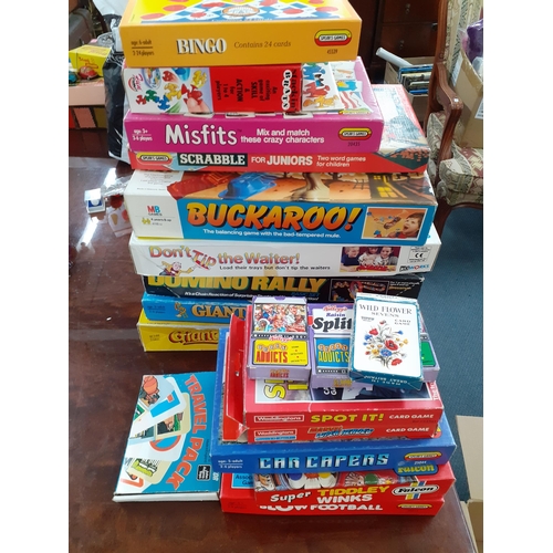 383 - A quantity of vintage puzzles, games and toys to include Waddingtons jigsaw puzzles, a child's cash ... 