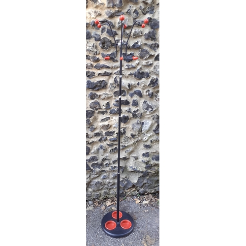 386 - A retro hat stand with red accents to the coat hooks and base below
Location: RAB