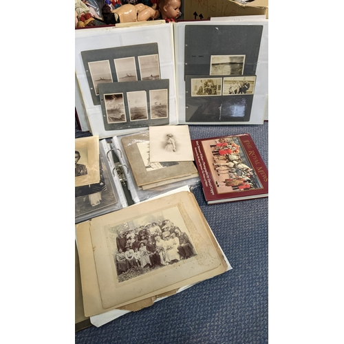 389 - A selection of mainly military related ephemera to include a scrap album, photograph albums and othe... 