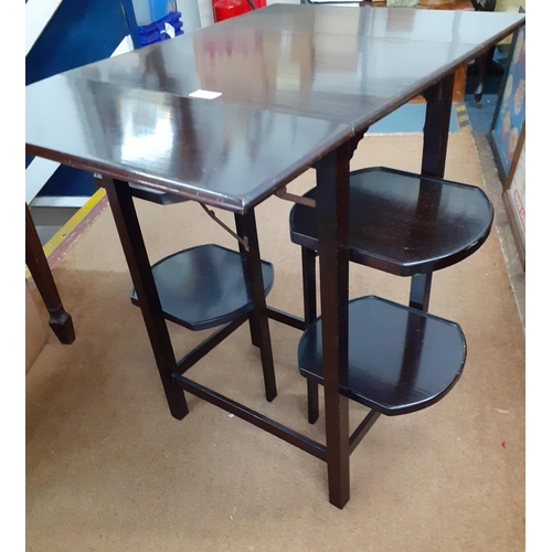 489 - An early 20th century mahogany tea table/cake stand with drop leaves and four flaps along with cigar... 