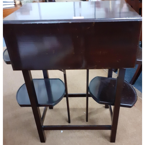 489 - An early 20th century mahogany tea table/cake stand with drop leaves and four flaps along with cigar... 