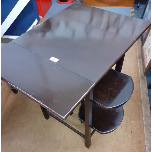 489 - An early 20th century mahogany tea table/cake stand with drop leaves and four flaps along with cigar... 