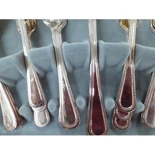 509 - A canteen of Viners 'Traditional Bead' 6 setting silver plated cutlery in a modern mahogany style bo... 