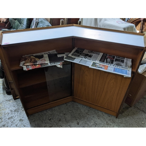 521 - Turnidge of London, mid-century teak cocktail bar, circa 1970, corner unit with side panel, white fi... 