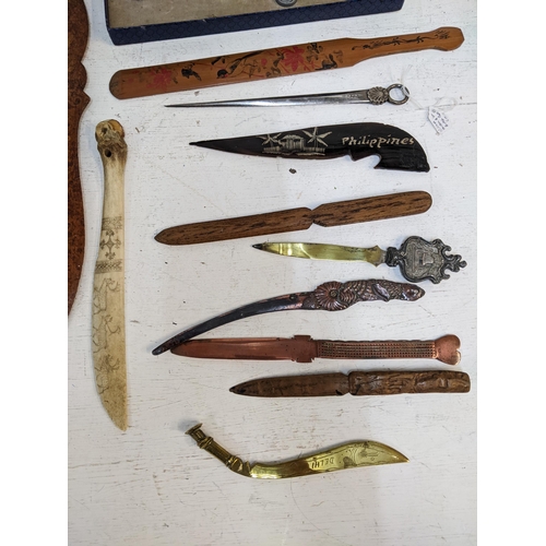 527 - A collection of paper knives and page turners, to include a Scrimshaw decorated with reindeer Orient... 