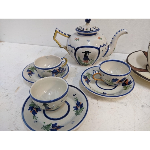 532 - Drinking related Quimper ware to include a matching teapot, large cup and saucer, tea pots, a set of... 