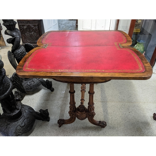 533 - A Victorian fold over swivel top walnut card table on turned columns and splayed legs 74cm x 92cm x ... 