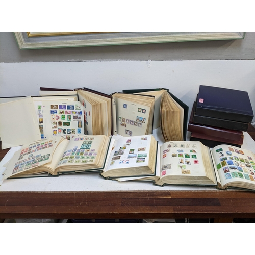 537 - A group of thirteen stock albums from around the world to include People's Republic of China, Sudan,... 