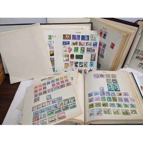 537 - A group of thirteen stock albums from around the world to include People's Republic of China, Sudan,... 