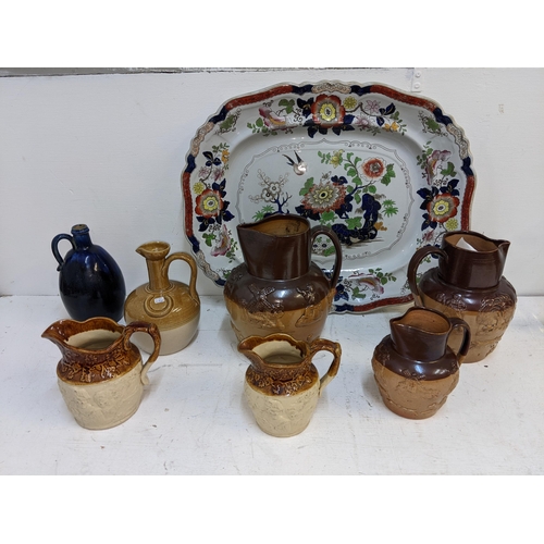 8A - Stoneware to include Stiff & Son and other harvest jugs, a Buchan jug, a Doulton blue glazed bottle ... 