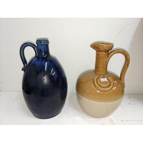 8A - Stoneware to include Stiff & Son and other harvest jugs, a Buchan jug, a Doulton blue glazed bottle ... 