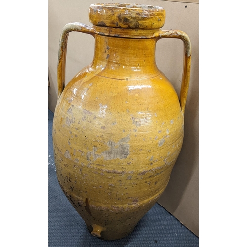 499 - A 19th century large twin handled Orcio wine/olive oil jar having a majolica glaze 107.5cm h x 55cm ... 