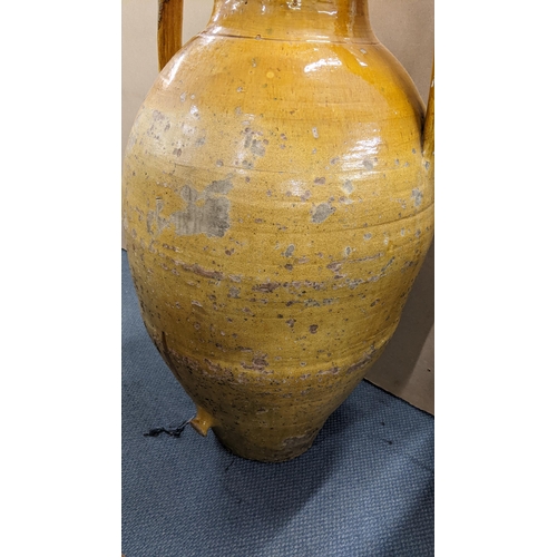 499 - A 19th century large twin handled Orcio wine/olive oil jar having a majolica glaze 107.5cm h x 55cm ... 