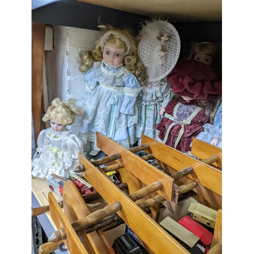 345 - A selection of toys and other items to include many collector's dolls, various Lledo Days Gone model... 