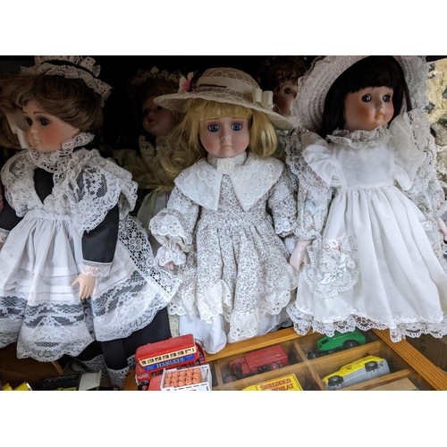 345 - A selection of toys and other items to include many collector's dolls, various Lledo Days Gone model... 