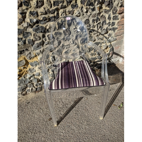 347 - A Louis Ghost Kartell transport polycarbonate armchair designed by Philippe Starck, with detachable ... 