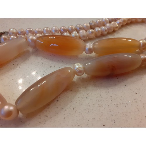 4 - Bvlgari-A vintage necklace having pink simulated pearls and 9 pink and peach hue agate cylindrical s... 