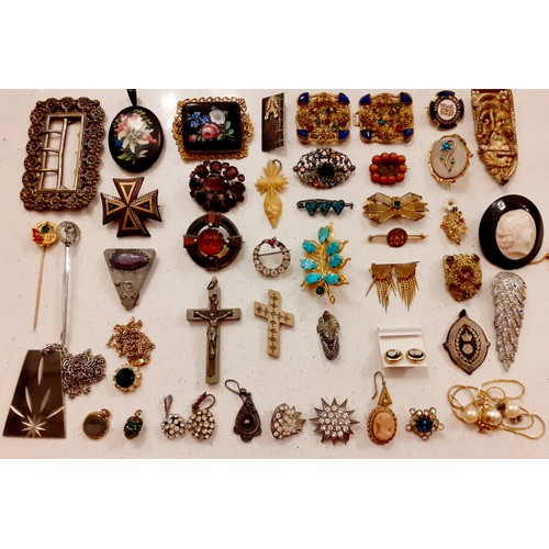 51 - Victorian and later costume jewellery, mainly brooches and pendants to include a Scottish white meta... 