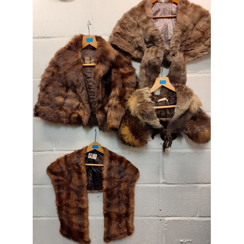 100 - A quantity of vintage fur wraps, collars, insertions and remnants to include a wolf stole, a fox col... 