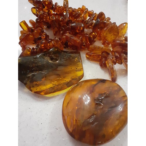 56 - A quantity of mid to late 20th Century amber costume jewellery to include orange, butterscotch and r... 