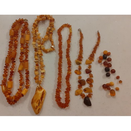 56 - A quantity of mid to late 20th Century amber costume jewellery to include orange, butterscotch and r... 