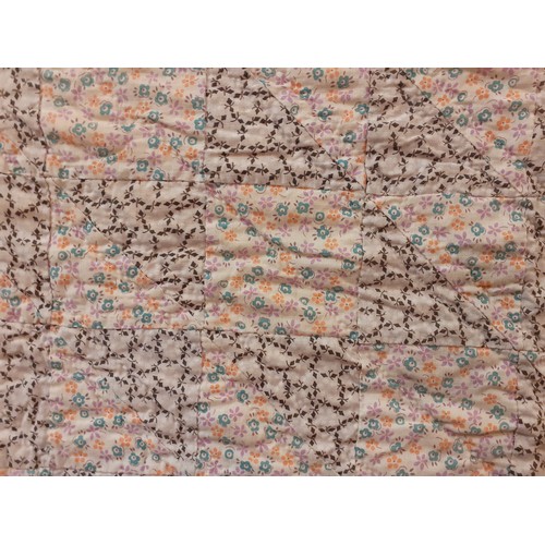 34 - A mid 20th Century American Mid West double layer handmade patchwork quilt in 2 floral patterns on a... 
