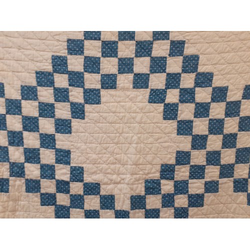 35 - Two 1970's American Mid West blue and white handmade double layer patchwork quilts A/F with machined... 