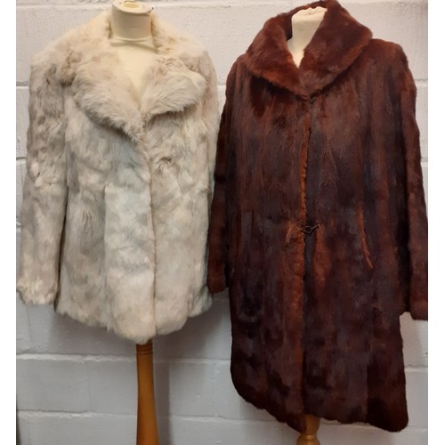 103 - A vintage arctic rabbit fur jacket with internal leather trim to the fastening, 38