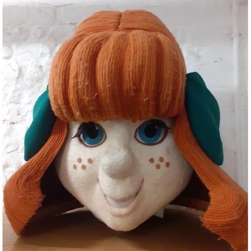 104 - A Carnival head in the form of a cartoon female having orange woollen hair and a large green bow, th... 