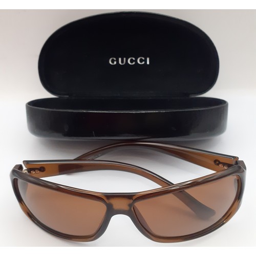 6 - Gucci-A pair of brown 'Horse-Bit' sunglasses with brown lenses, model number GG2574/S having a brand... 