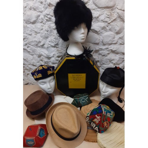 109 - A group of hats to include a 1960's Russian black rabbit fur hat, 2 modern Trilby hats and an Uzbek/... 