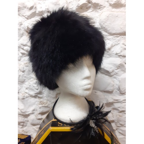 109 - A group of hats to include a 1960's Russian black rabbit fur hat, 2 modern Trilby hats and an Uzbek/... 