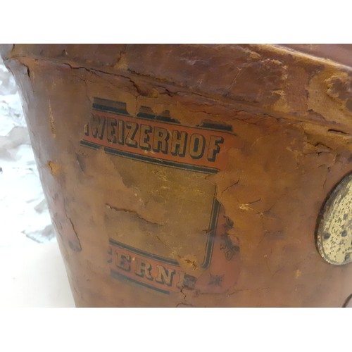 48 - A Victorian brown leather top hat box with fitted red silk interior having a Continental travel stic... 