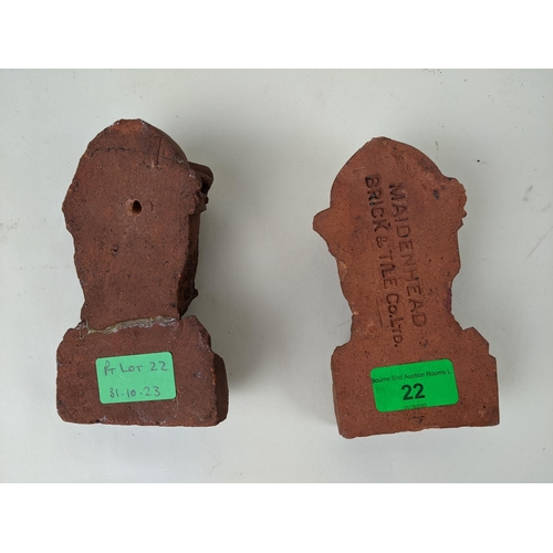 22 - A pair of terracotta corbels in the form of Medieval knights, both stamped Maidenhead Brick & Tile C... 