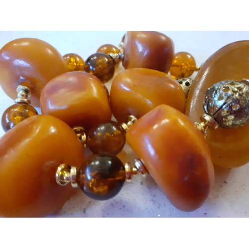 70 - Five vintage necklaces to include butterscotch amber. Location:R1.4