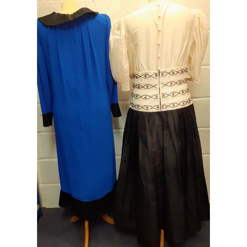 76 - An early 1980's Frank Usher cobalt blue cocktail dress with black ruffled cross-over collar, cuffs a... 