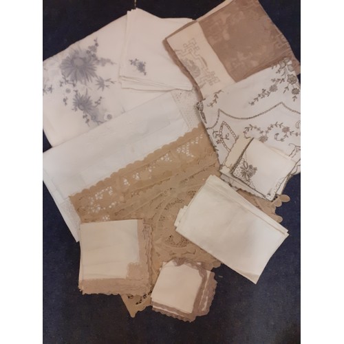 120 - A quantity of vintage table linen to include a Madeira beige and ecru cutwork tablecloth 46