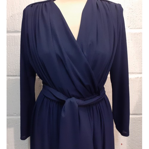 118 - A late 1970's Trina Lewis & Marjon Couture navy wrap-around dress with plunge neckline, UK size 14. ... 