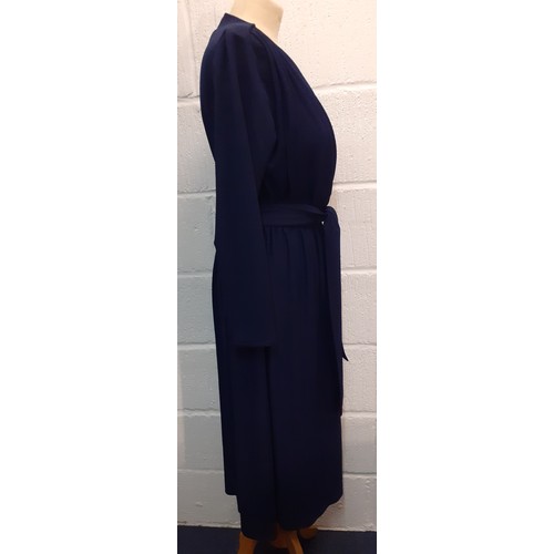 118 - A late 1970's Trina Lewis & Marjon Couture navy wrap-around dress with plunge neckline, UK size 14. ... 