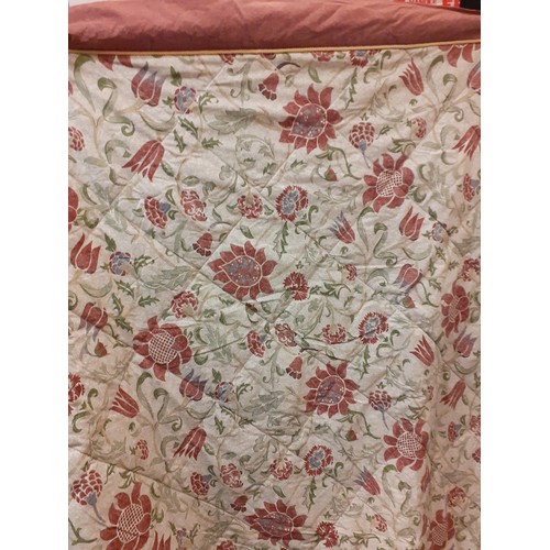 114 - Two late 20th Century Vantona quilts having a rust and mauve floral design with green leaves on a gr... 