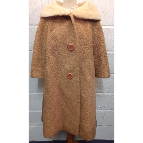 77 - A mid 20th Century American B.Forman & Co tan boucle lambswool swing ladies coat having an arctic mi... 